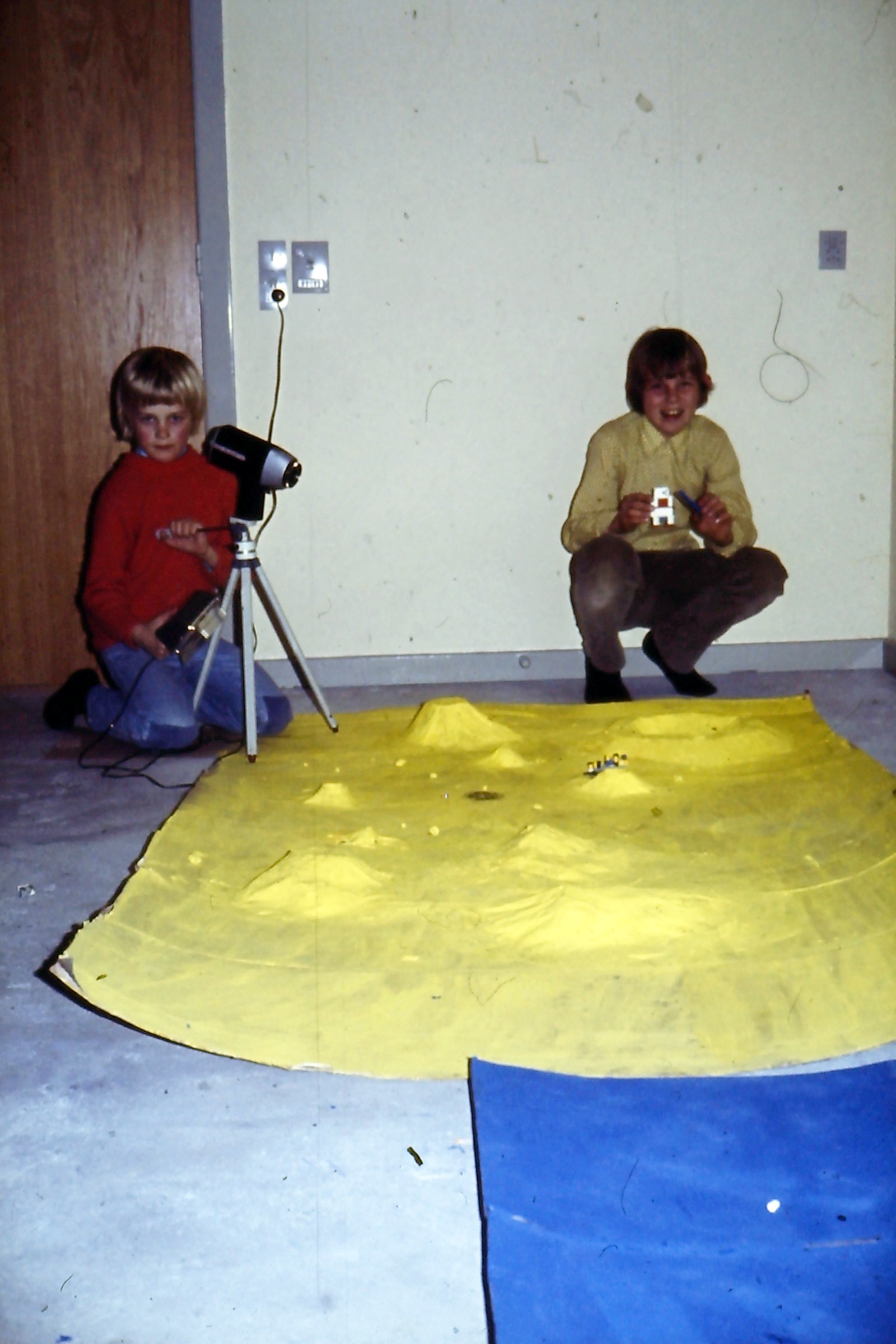Henrik filming at the moon landscape, Lars is holding the lunar module